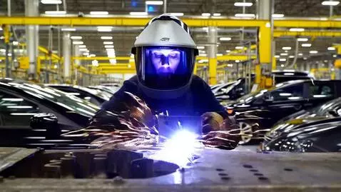 AI Video from prompt: Car factory. A welder breaks a defective part. A