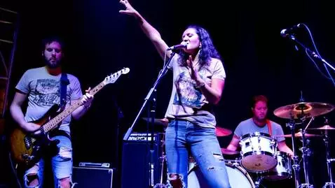 AI Video from prompt: Indie rock band playing live