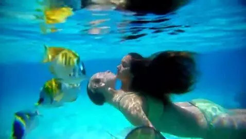 AI Video from prompt: a woman floating on her back in the turquoise bl