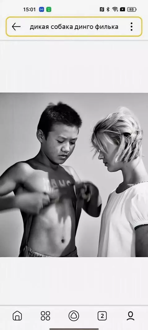 AI Video from prompt: Boy rips shirt and draws tattoo of bellydancer o