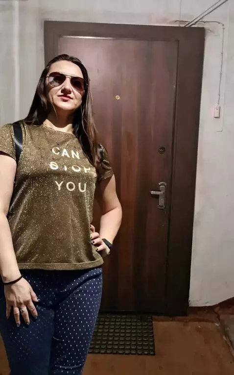 AI Video from prompt: The woman turns to the door walks up to the door