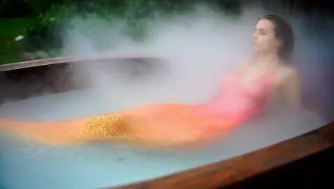 AI Video from prompt: Mermaid swimming in a hot tub