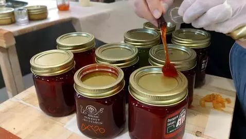 AI Video from prompt: a group of jars of jelly, jamming a jam in the j