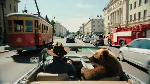 AI Video from prompt: A forward view from the backseat of a convertibl