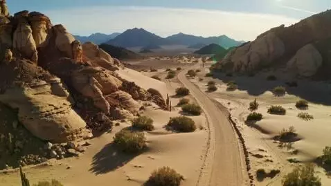 AI Video from prompt: Create a video of a hiking trail and a dirt road