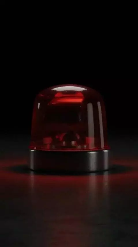 AI Video from prompt: Cinematic close-up of a vintage red emergency be