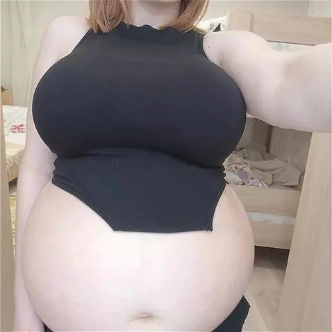 AI Video from prompt: The girl's belly fills with water and becomes la