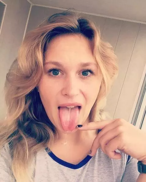 AI Video from prompt: The girl opens her mouth wide and sticks out her