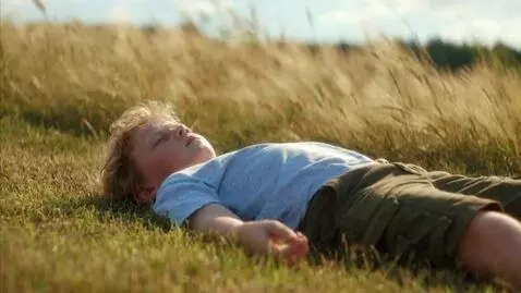 AI Video from prompt: A fourth-grader with slightly disheveled straw-c