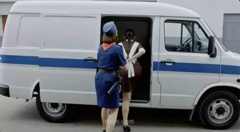 AI Video from prompt: Policewoman (woman #1) is wearing an above-the-k