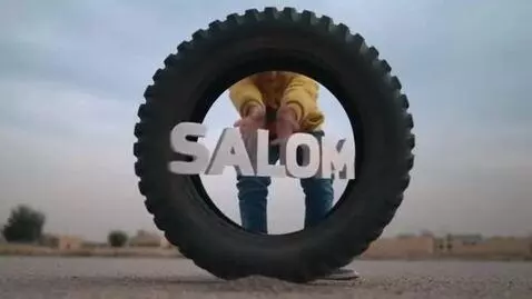 AI Video from prompt: a large car tire from the center, the little boy