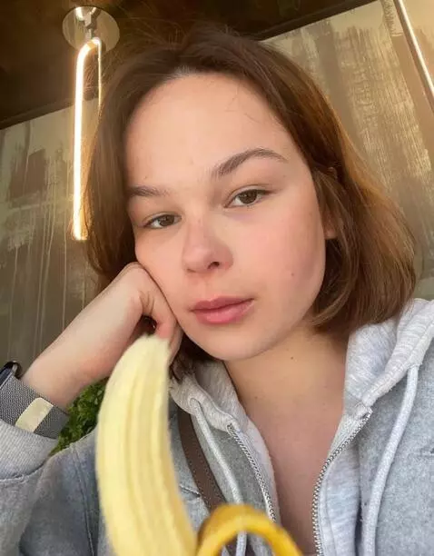 AI Video from prompt: girl gently sucking banana