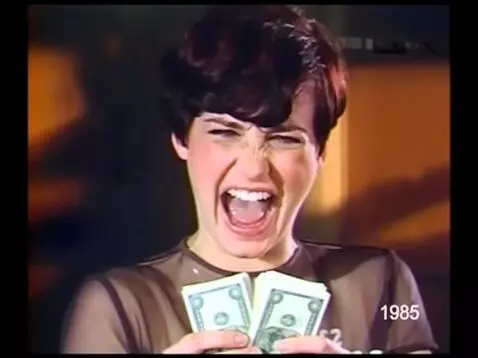 AI Video from prompt: The woman in the photo takes out the dollars fro