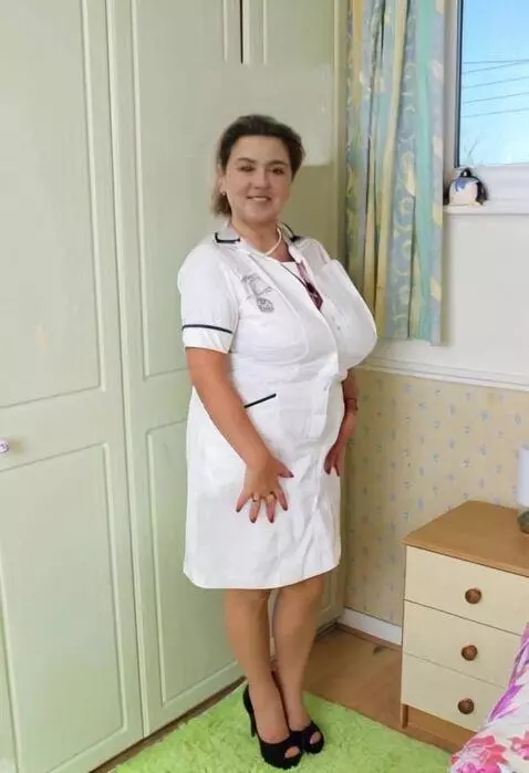 AI Video from prompt: The woman turns her face and shows her breasts