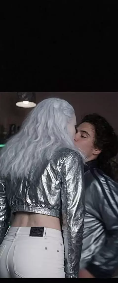 AI Video from prompt: the snow queen in snow-white trousers kisses a y