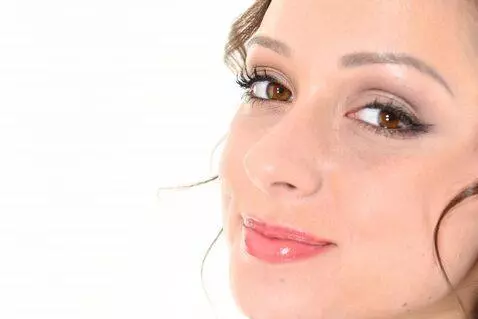 AI Video from prompt: The girl looks at the camera positively and says