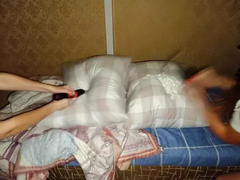 AI Video from prompt: Beautiful girls brutally destroy down pillows wi