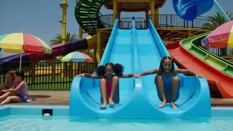 AI Video from prompt: 8 year old girls playing at water park