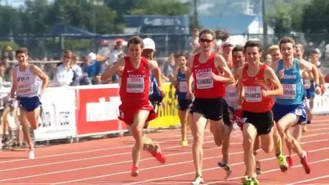 AI Video from prompt: A group of intense runners in a competitive trac