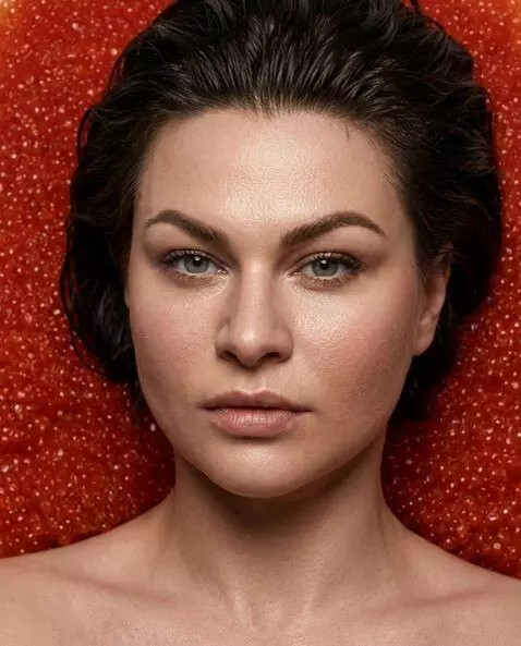 AI Video from prompt: The girl in the photo turns to the camera and sl