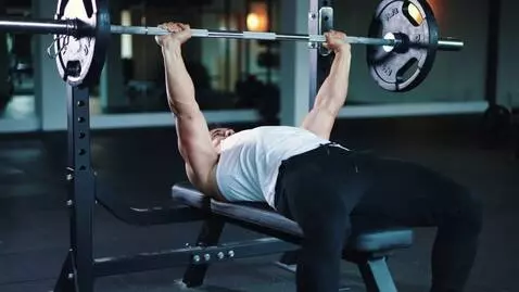 AI Video from prompt: make a video where a man presses a barbell from 