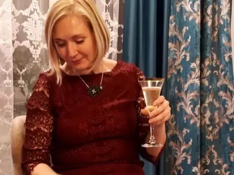 AI Video from prompt: The woman in the photograph is wearing a miniski