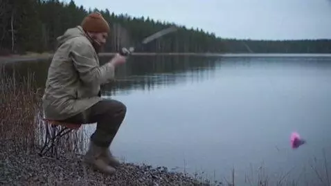 AI Video from prompt: 0–3 sec: The fisherman is sitting on the shore, 