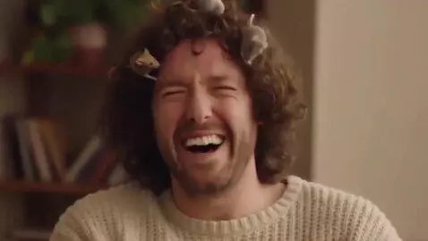 AI Video from prompt: Mice are playing in man’s hair as man laughs hys