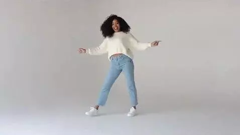 AI Video from prompt: Woman is dancing and smiling