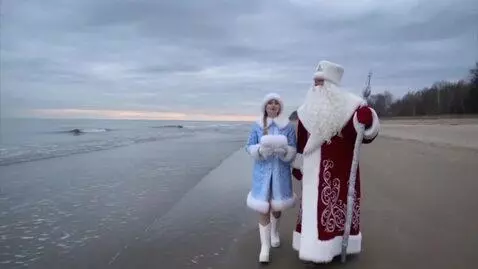 AI Video from prompt: a video clip of  ded moroz walking on the beach 