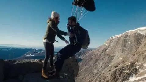 AI Video from prompt: A parachutist jumping from the mountain touches 