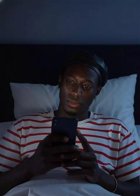 AI Video from prompt: He  is quiet chatting with his phone. The phone'