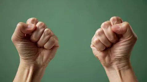 AI Video from prompt: hands straight in front of me, clenched into fis