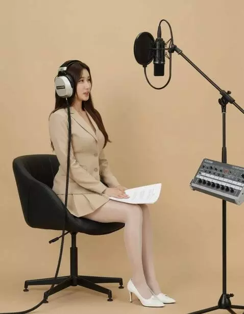 AI Video from prompt: A woman wearing headphones reads a text. The cam