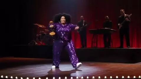 AI Video from prompt: Create a video of a large woman on stage dancing