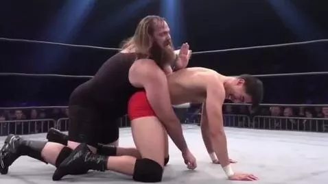 AI Video from prompt: Big bearded wrestler making back and forth movem