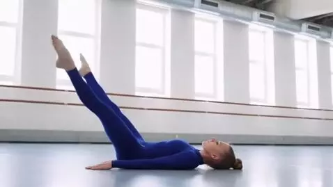 AI Video from prompt: gymnast lying on its back, legs straight up in t