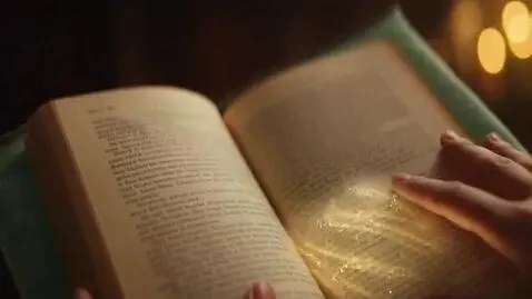 AI Video from prompt: Young woman read book, go through the book porta