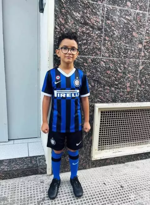 AI Video from prompt: he is lying on the couch. The camera is moving a