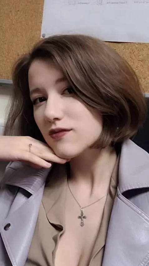 AI Video from prompt: The woman opens her mouth and sticks out her ton