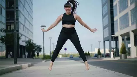 AI Video from prompt: Makima, with her huge breasts, is jumping up and