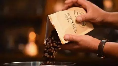 AI Video from prompt: Close-up shot: barista hands pouring fresh coffe