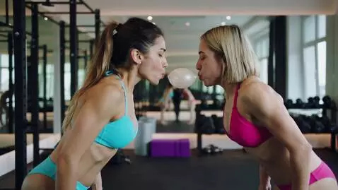 AI Video from prompt: Women  in bikini blowing gym ball by mouth from 