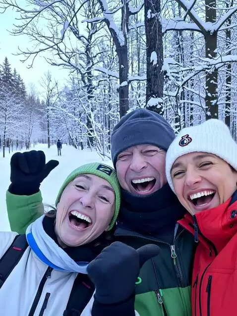 AI Video from prompt: Three people are laughing and rejoicing. Snow is