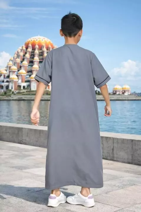 AI Video from prompt: a child promotes the robe he is wearing