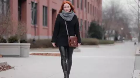 AI Video from prompt: Mature redhead lady in leather leggings