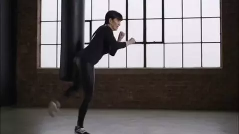 AI Video from prompt: Woman 67 years old,black hair bangs,leather legg