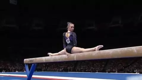 AI Video from prompt: gymnast doing middle splits on balance beam