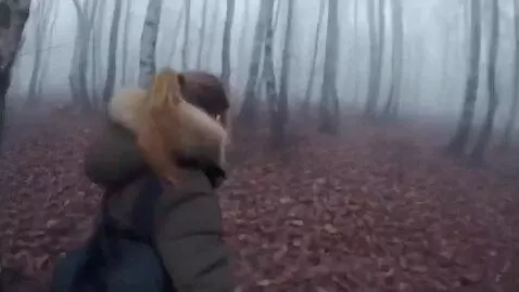 AI Video from prompt: A young Russian woman named Katya is filming an 