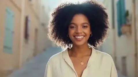 AI Video from prompt: A beautiful woman moves and smiling